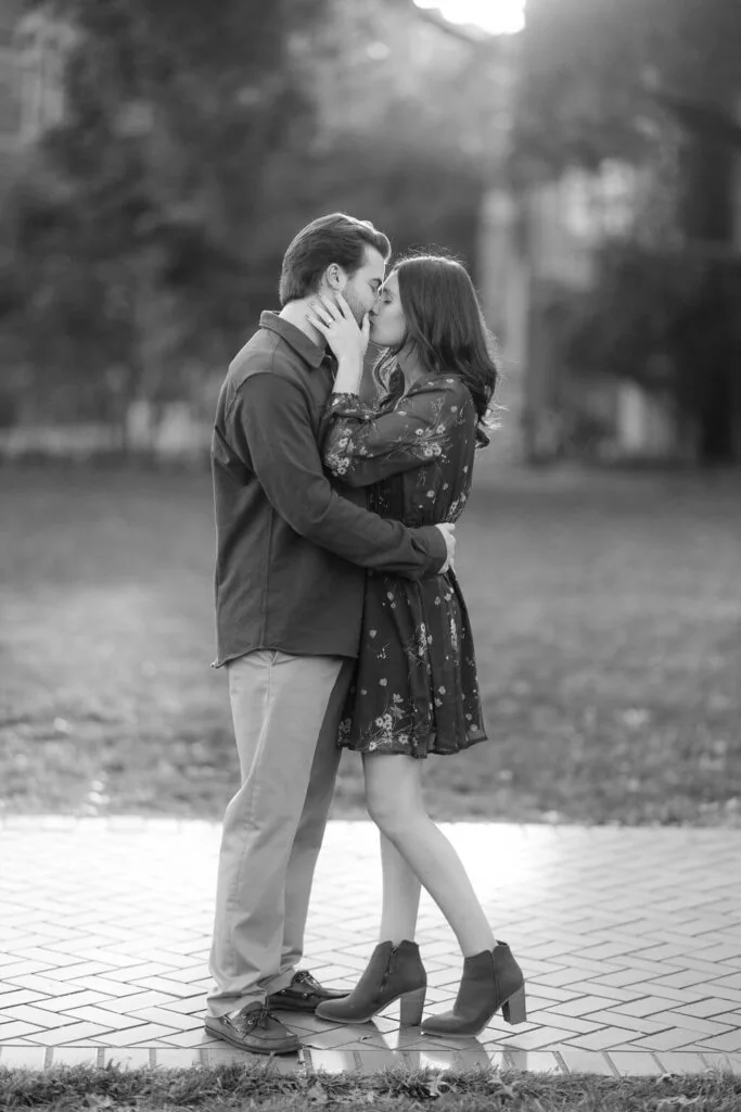 Engaged couple embracing in a black and white portrait in Washington DC