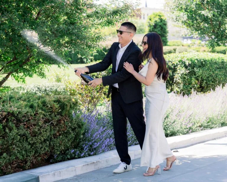 Newly engaged couple celebrating together outdoors
