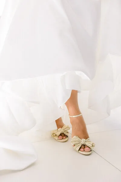 Bride’s gown and shoes during wedding preparations