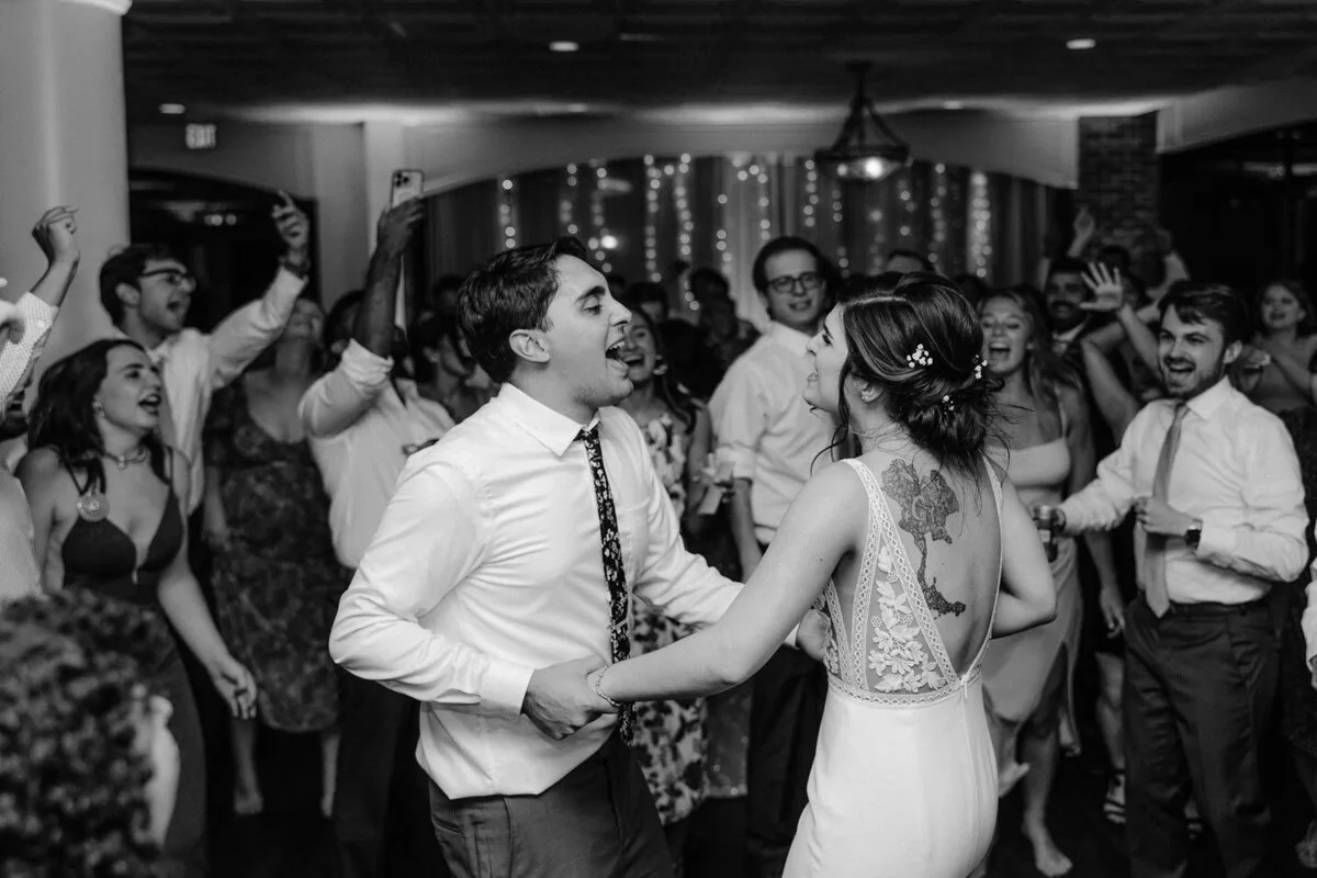 Newlyweds dancing together at their wedding reception